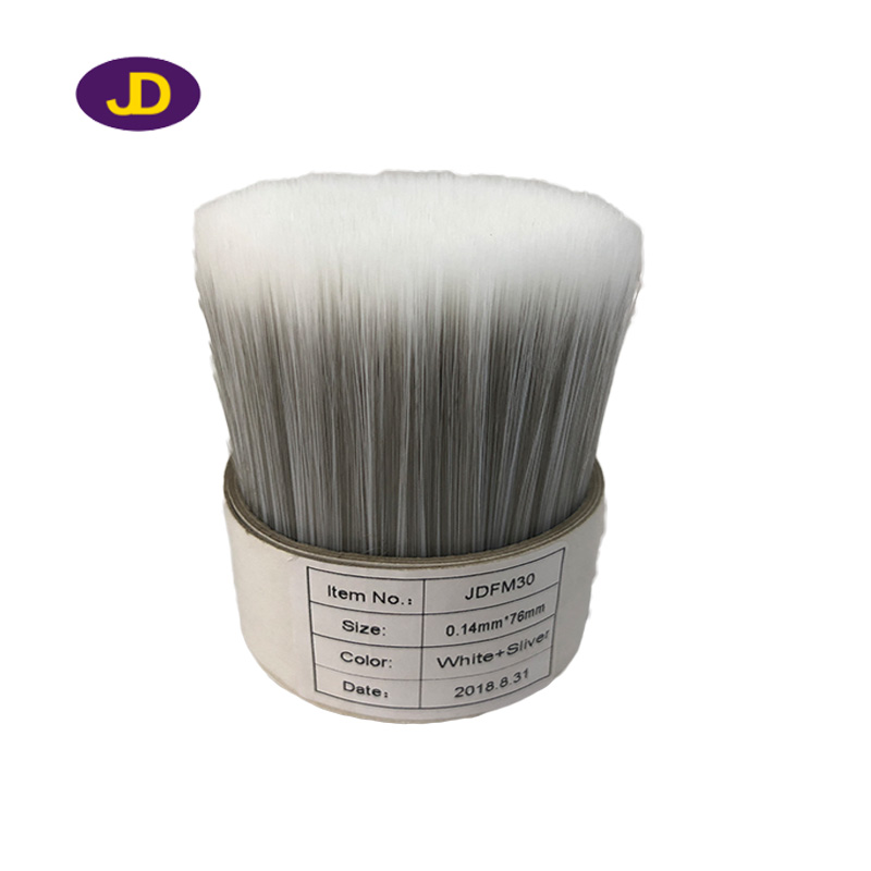 Soft solid tapered brush filament for pa...